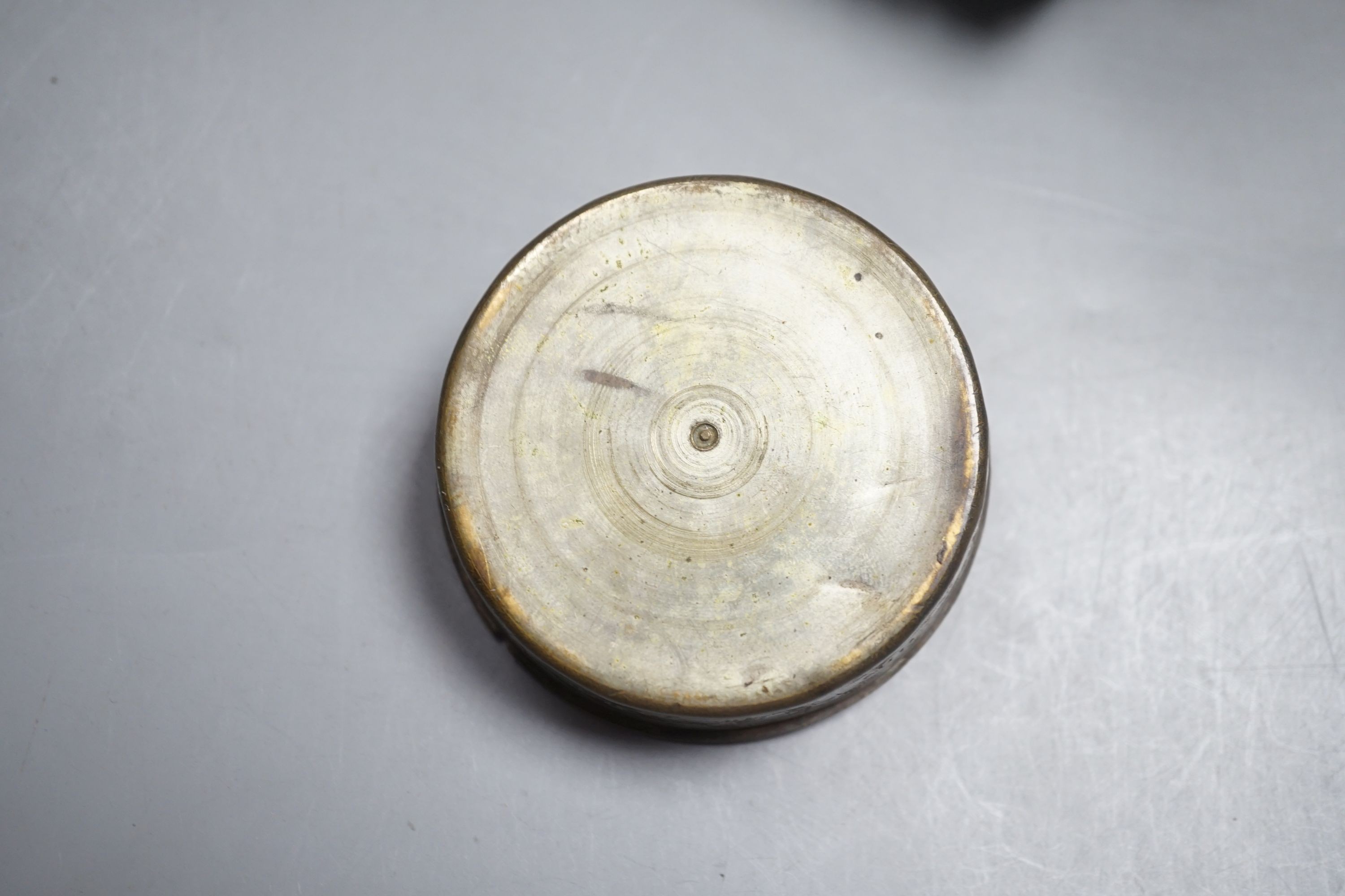 A 19th century Tibetan white metal mounted copper prayer wheel with interior script and a Persian painted mother-of-pearl pill box